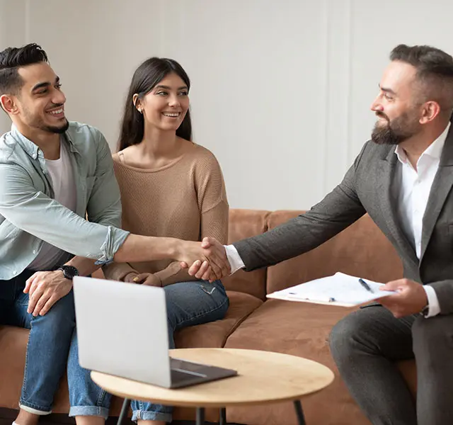 millennial-couple-buying-new-apartment-shaking-ha-2021-12-09-20-11-06-R8ZPKKE.jpg
